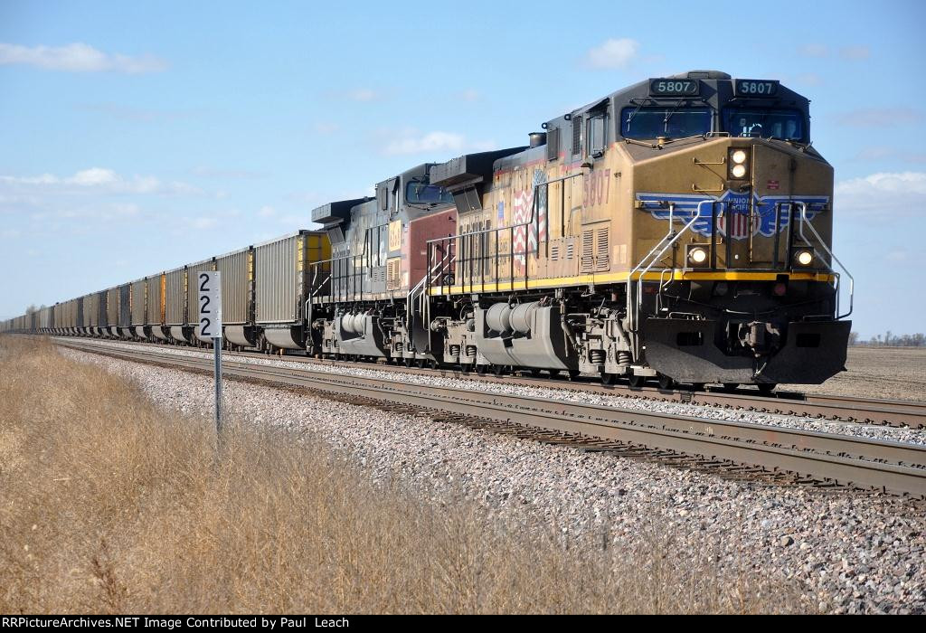 Loaded coal train rolls east